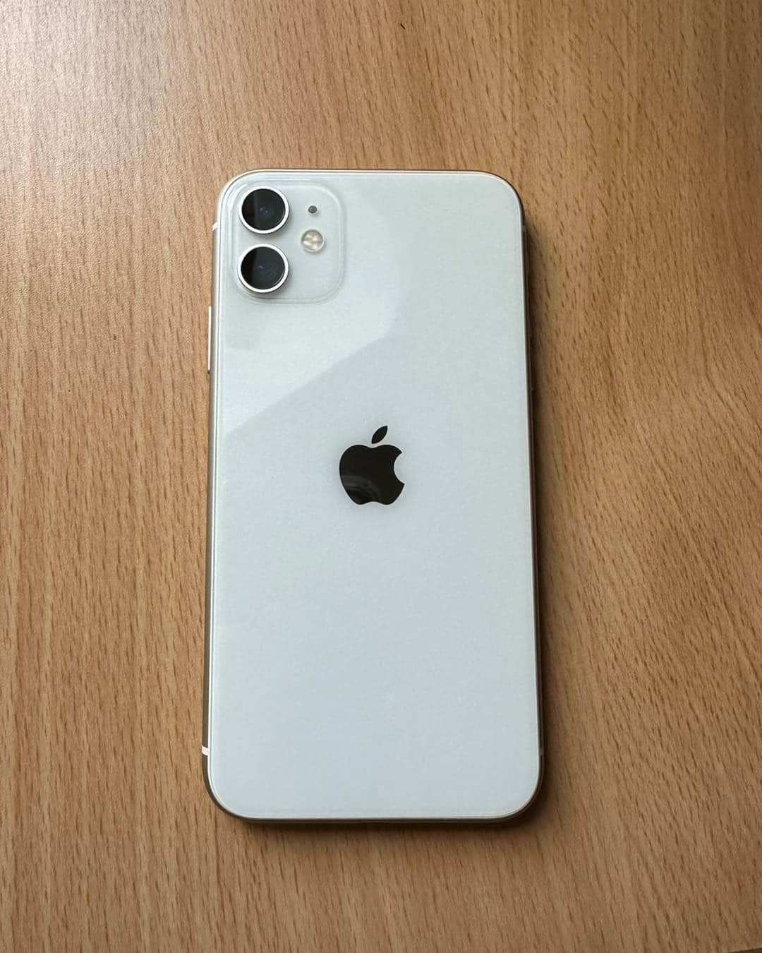 White iPhone 11 Back on a Wooden Table — Flexicoms Communications in Ingham, QLD