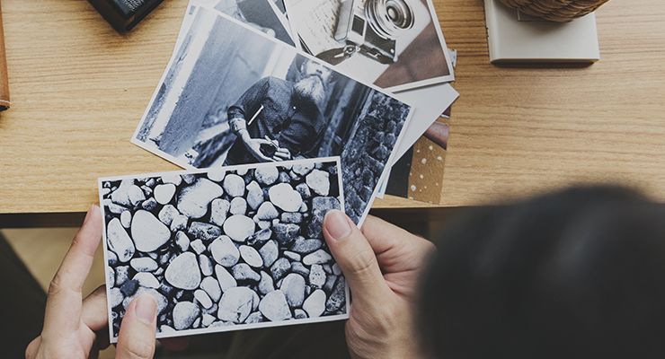 Hands holding photo prints