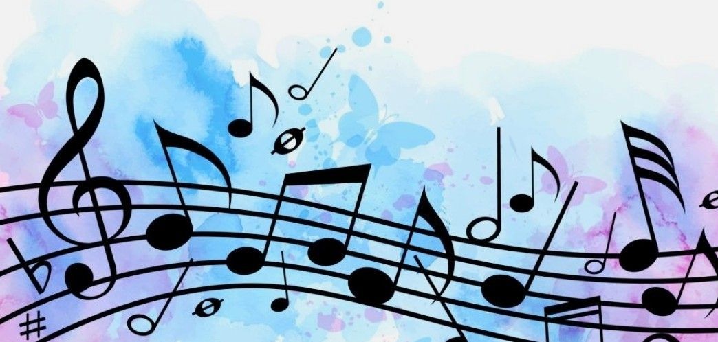 A bunch of music notes on a blue and pink background