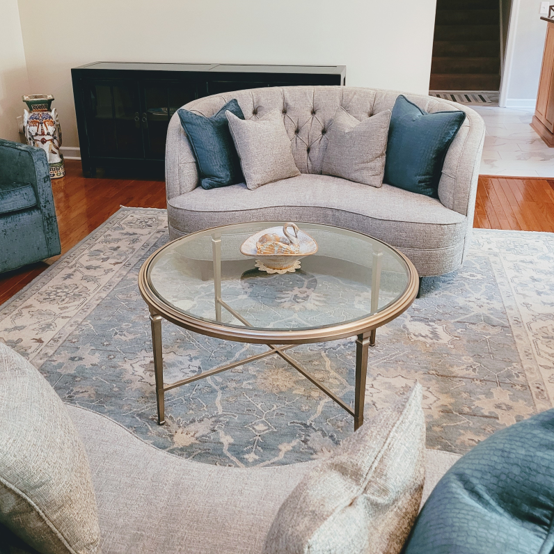 A living room with a couch and a coffee table