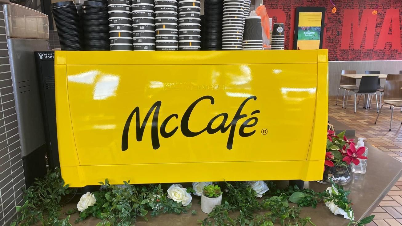 A Yellow Sign That Says Mccafe is in a Restaurant — Global Signage In Ingham, QL