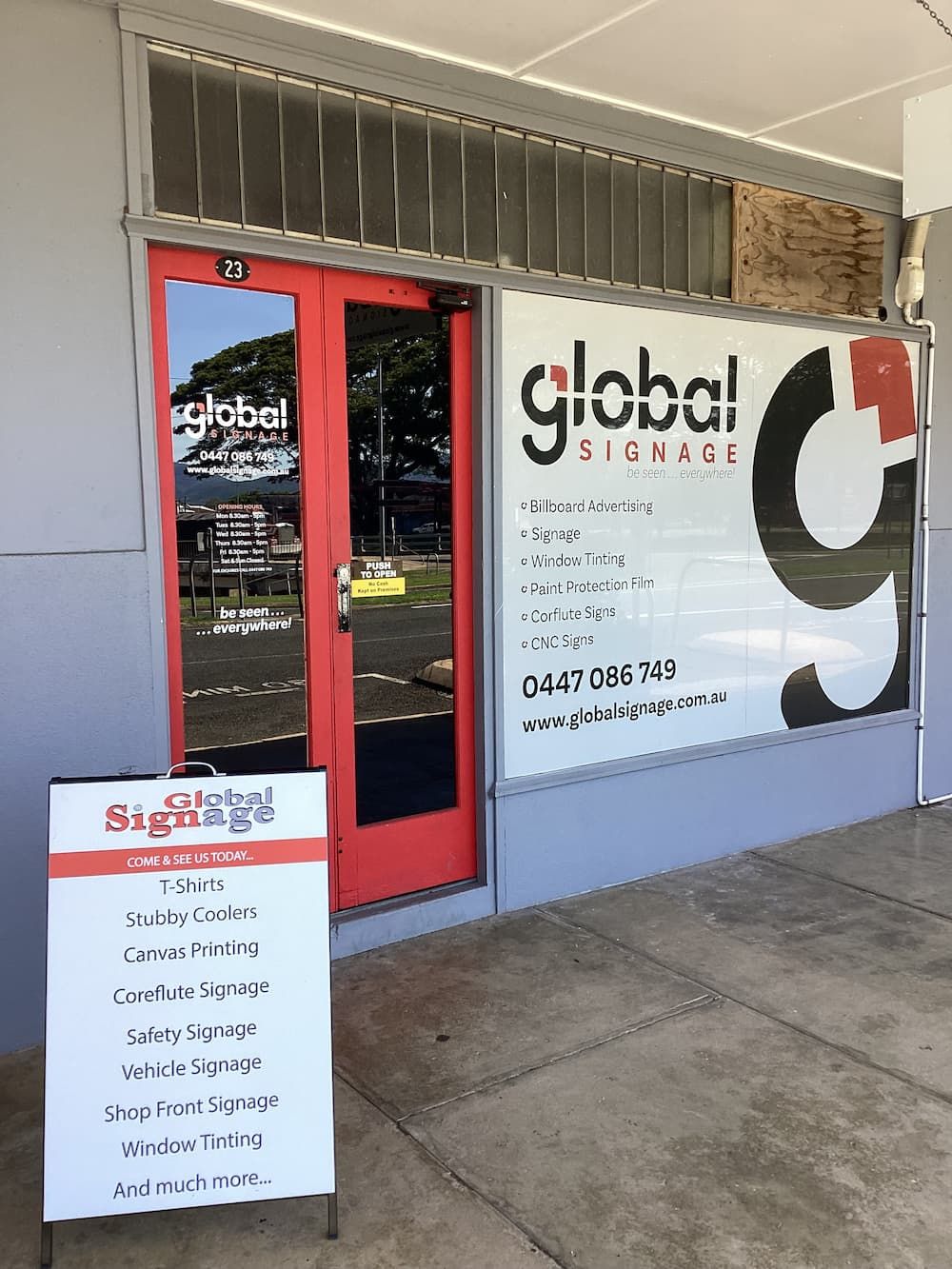 A Store Front With a Sign That Says Global Signage — Global Signage In Ingham, QLD