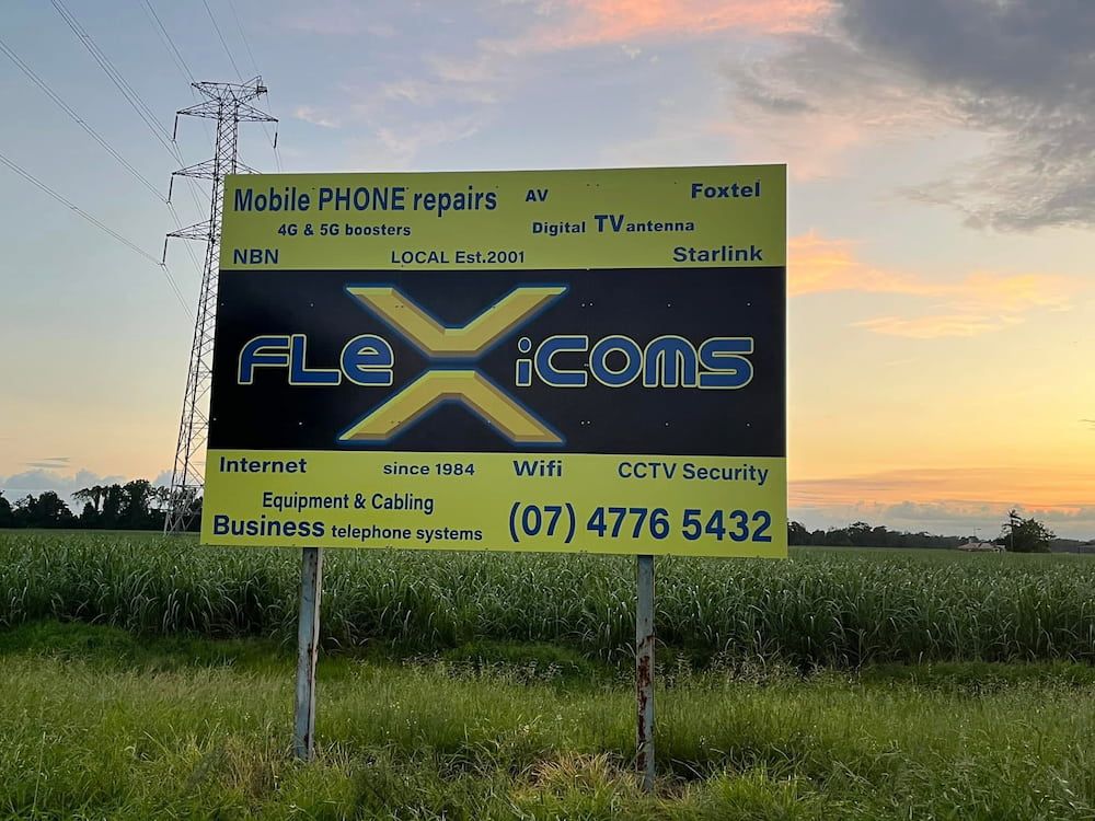 A Billboard for Flexicons is in the Middle of a Field — Global Signage In Ingham, QLD