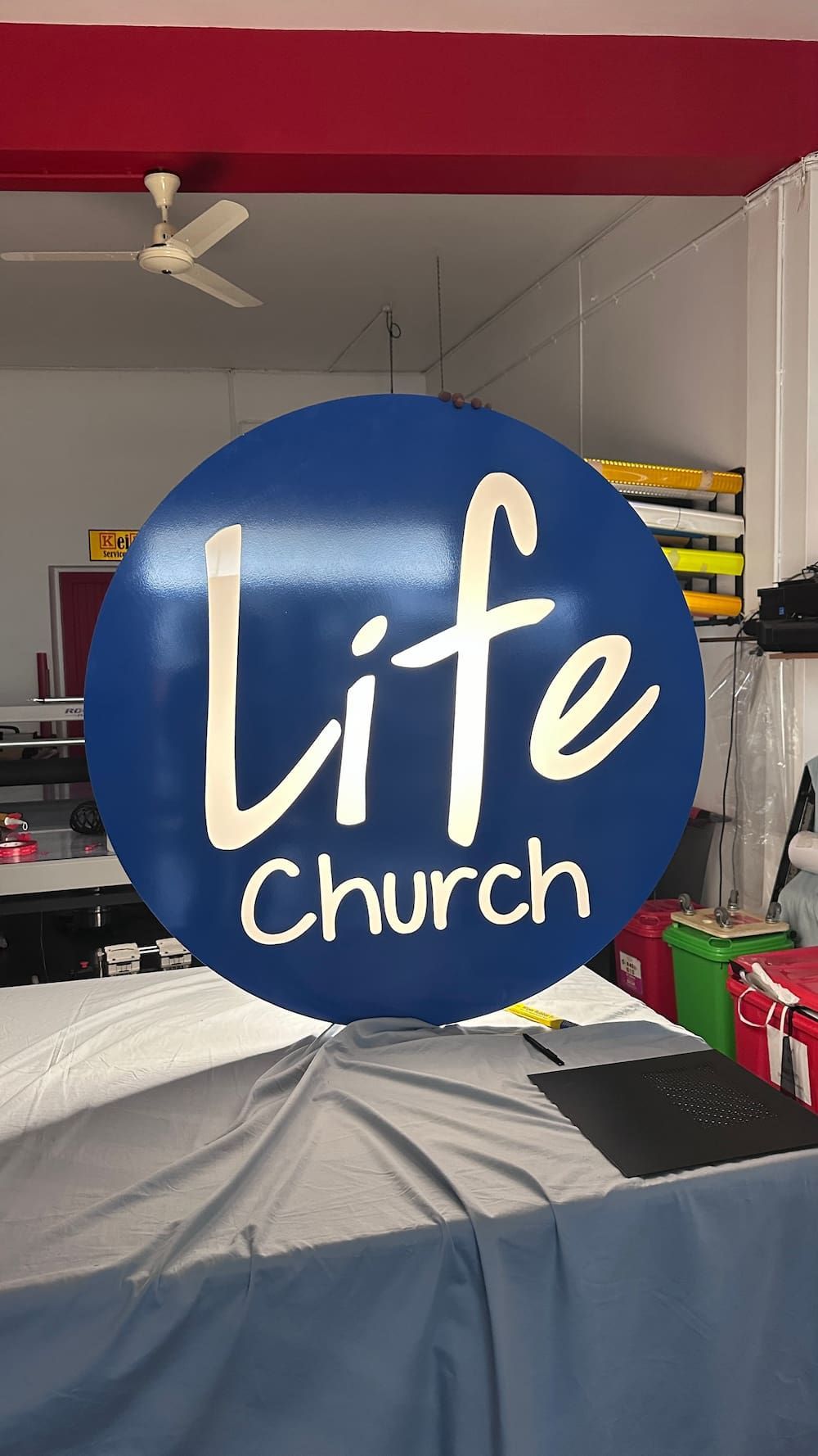 A Life Church Sign is Hanging From the Ceiling in a Room — Global Signage In Ingham, QLD