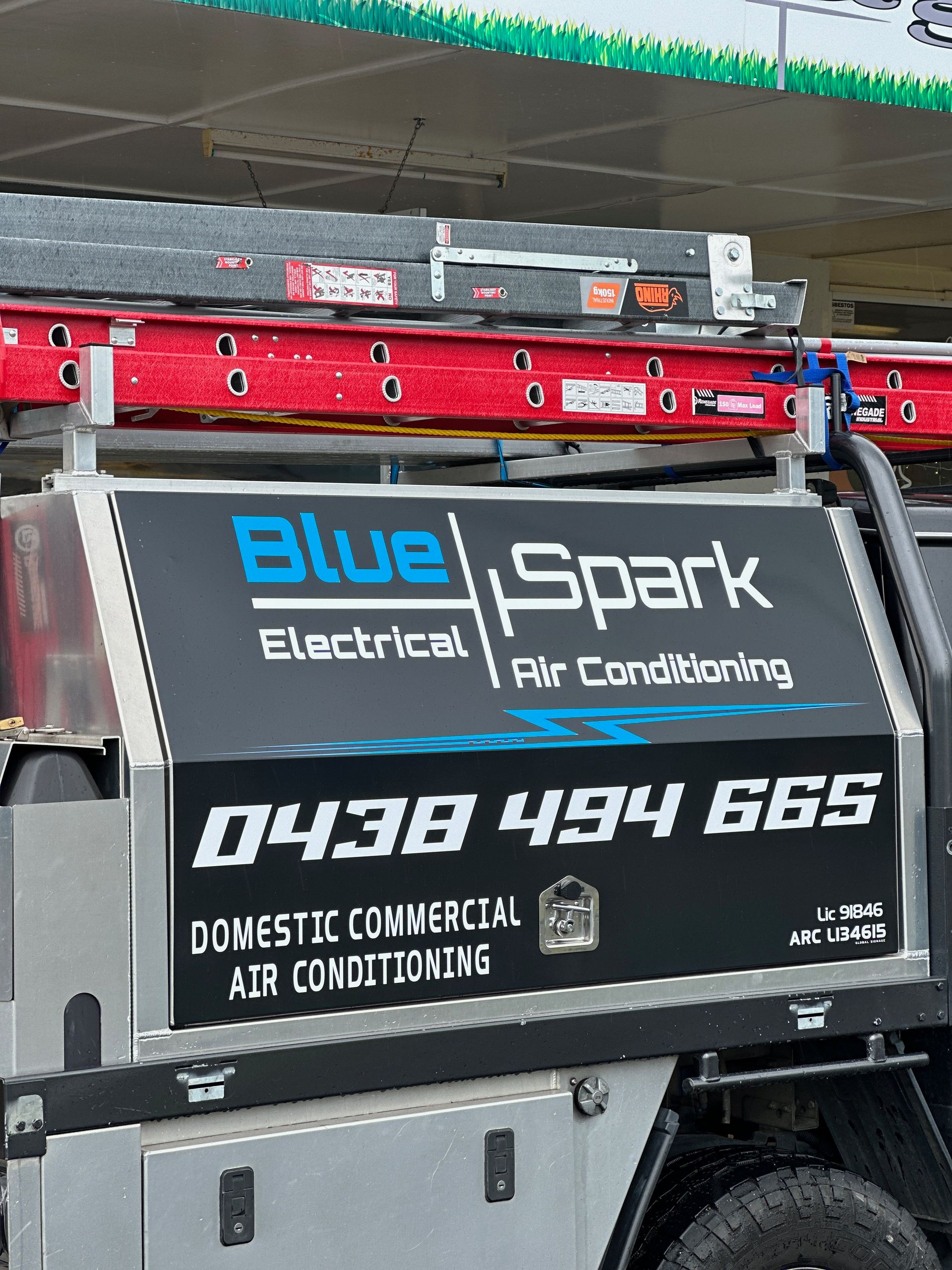 A truck with a sign that says blue spark electrical air conditioning — Global Signage In Ingham, QLD