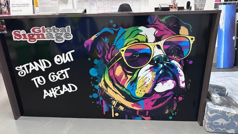A Colorful Painting of a Dog Wearing Sunglasses — Global Signage In Ingham, QLD