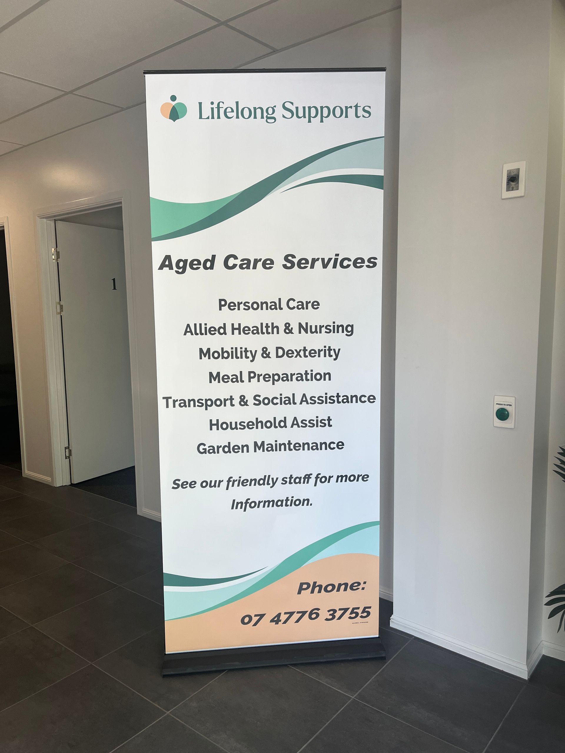 A sign for lifelong supports aged care services is in a hallway — Global Signage In Ingham, QLD