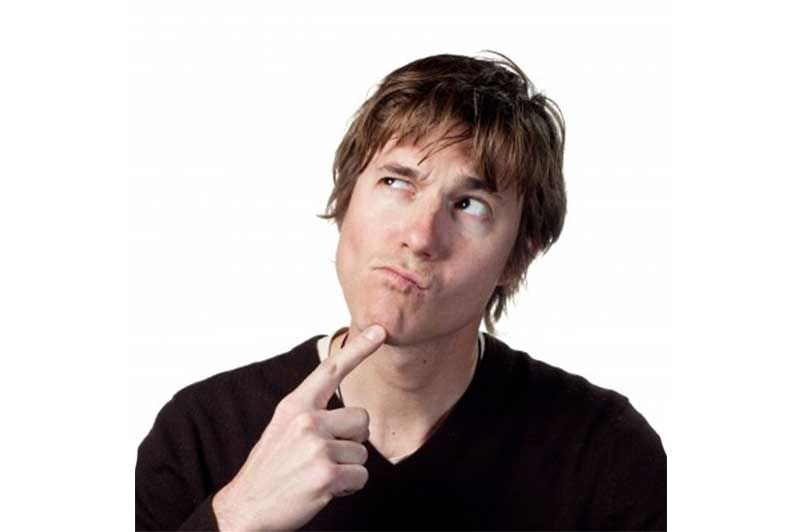A man is thinking with his finger on his chin.