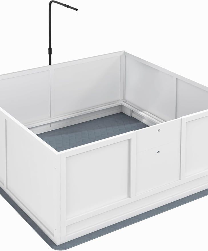 White dog bath with a black overhead grooming arm