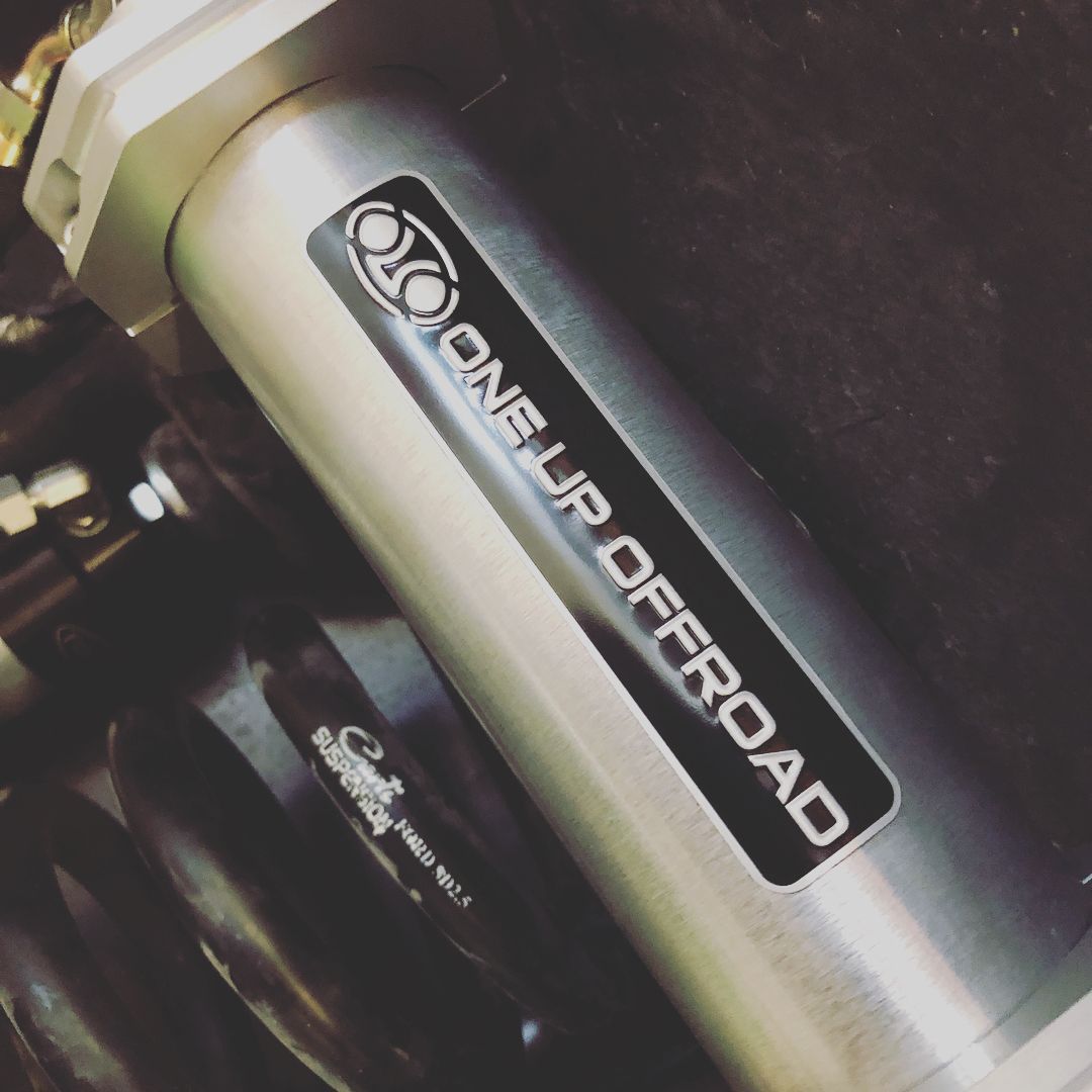 Close-up of a silver Offroad bike frame with a black ONNIP OFFROAD decal.