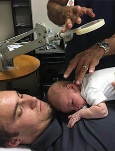 child in fathers chest - pediatric care in Bonita Springs, FL