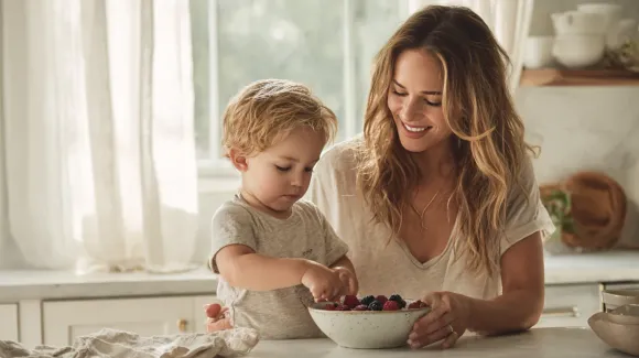 Woman and child in kitchen, preparing berries together.