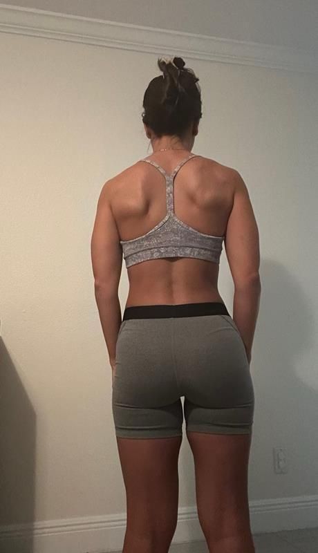 Woman's back in gray outfit after image