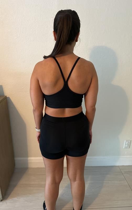 Woman's back in black outfit before image