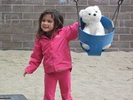 Girl with a Teddy Bear — Children's Center in Lakewood,, CA