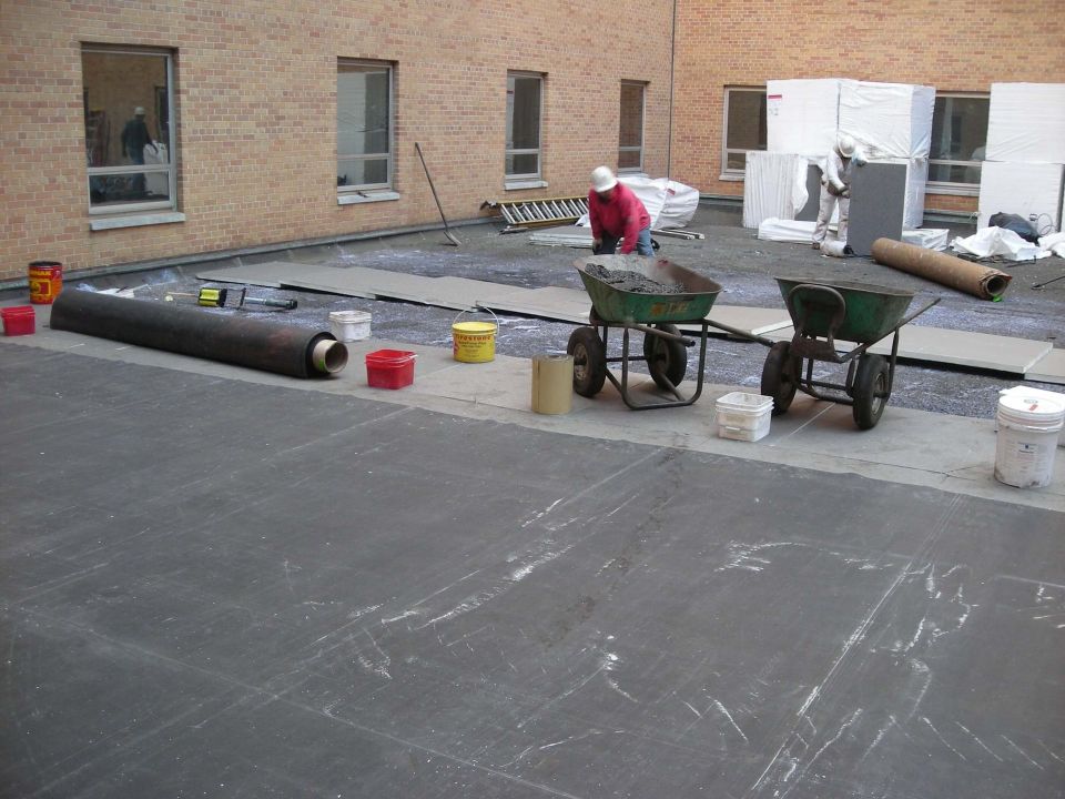 Worker on a flat roof