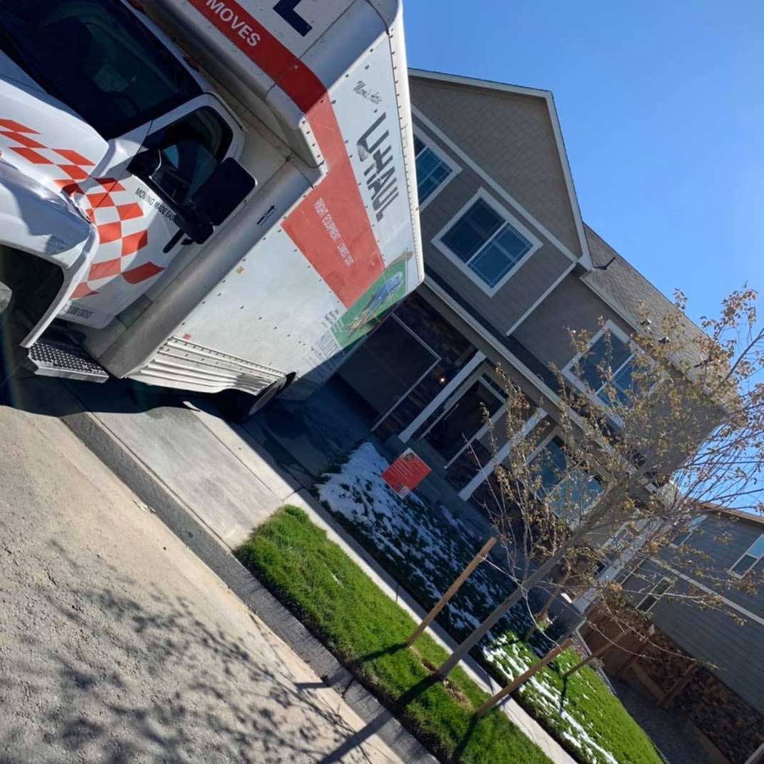 Moving Truck In Front of Residential House — Denver, CO — RnB Movers LLC