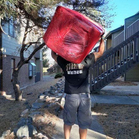 Man Lifting Furniture — Denver, CO — RnB Movers LLC