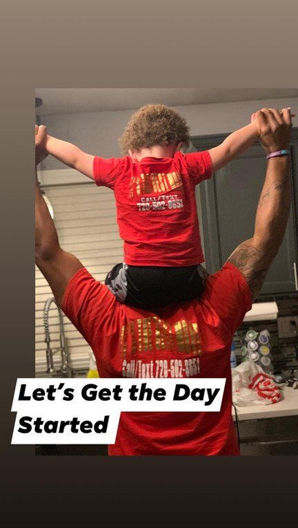 Man and Kid Wearing RnB Movers Red Shirt — Denver, CO — RnB Movers LLC