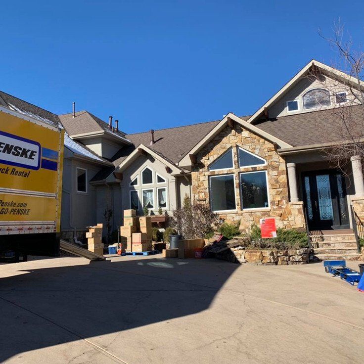 Moving Truck and Boxes Outside the House — Denver, CO — RnB Movers LLC