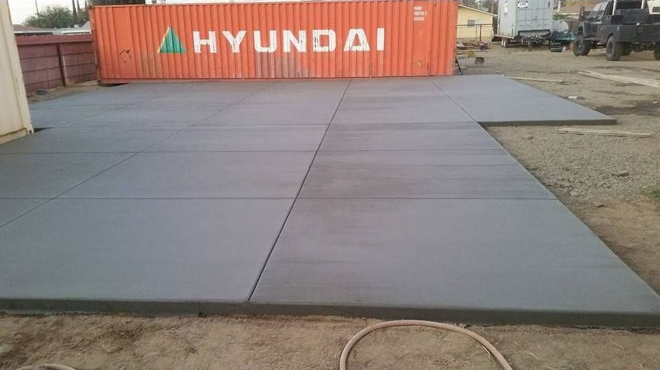 A hyundai shipping container is sitting on top of a concrete floor.