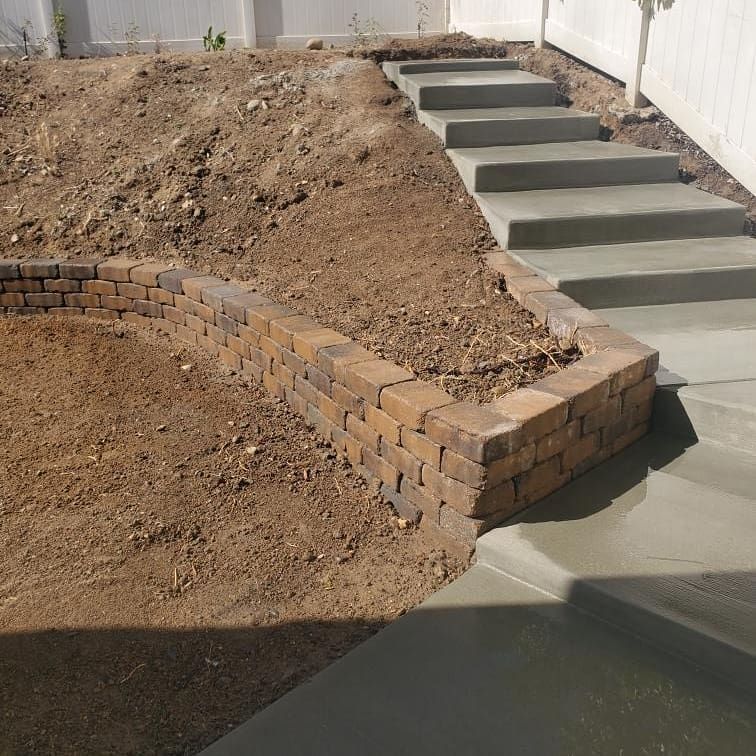 A set of concrete steps going up a hill