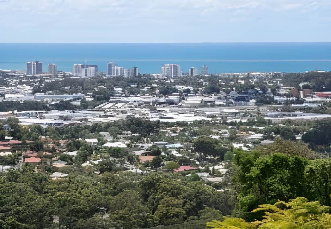 A View Of A City From A Hill Overlooking The Ocean And Buildings — Tailored Support Services Pty Ltd In Buderim, QLD