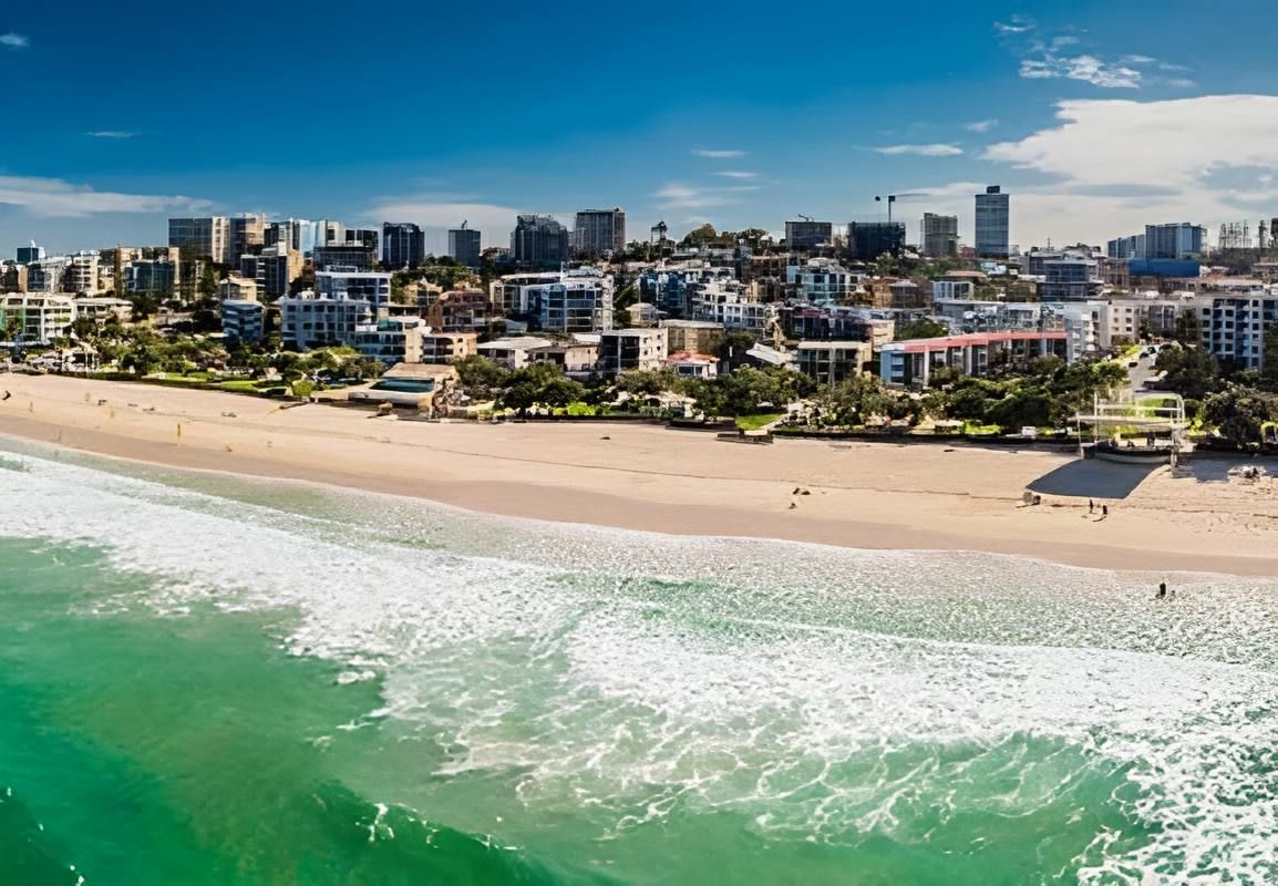 An Aerial View Of A Beach With A City In The Background — Tailored Support Services Pty Ltd In Caloundra, QLD