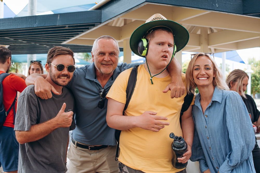 A Group Of People Are Posing For A Picture Together — Tailored Support Services Pty Ltd In Maroochydore, QLD