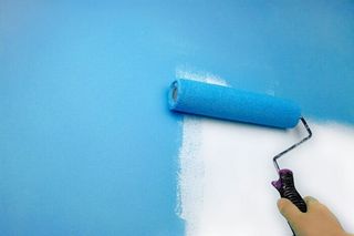 Painting a Wall with Blue Paint — Custom Painting in Lafayette, IN