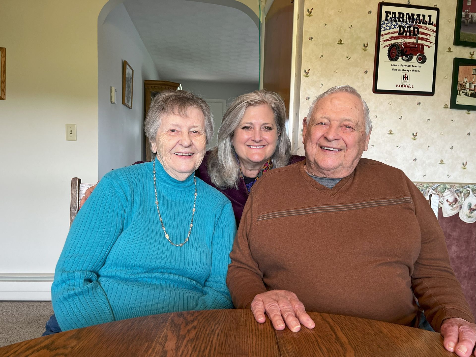Three people are posing for a picture
