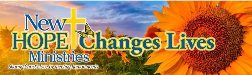 A man with a backpack is walking towards a tent with the words