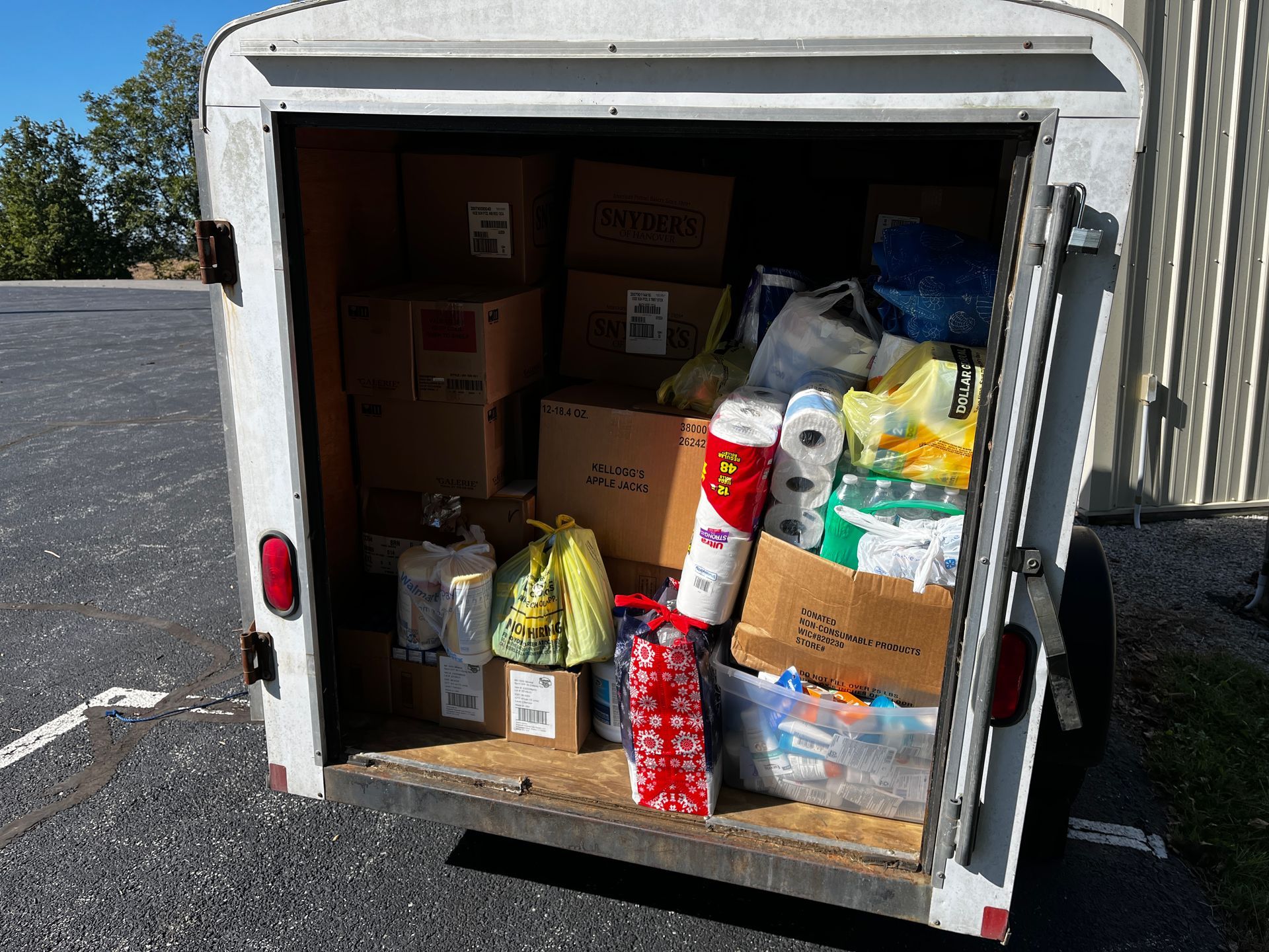 Trailer filled with boxes and supplies, likely donations.