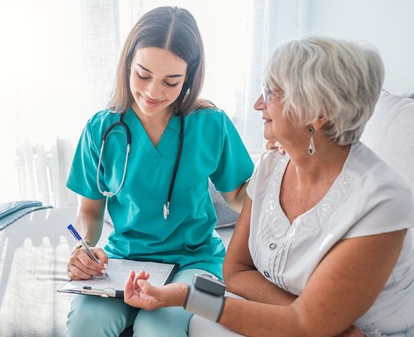 Nurse Measuring Blood Pressure — Muskego, WI — Quality Home Health Care Inc.