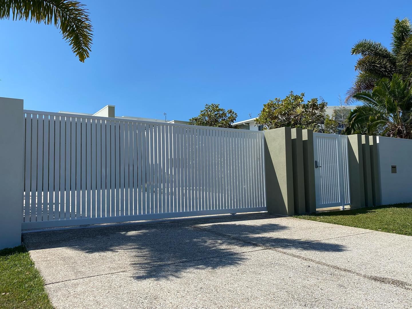 House with a Driveway and Aluminium Fence — Local Glaziers in Eton, QLD