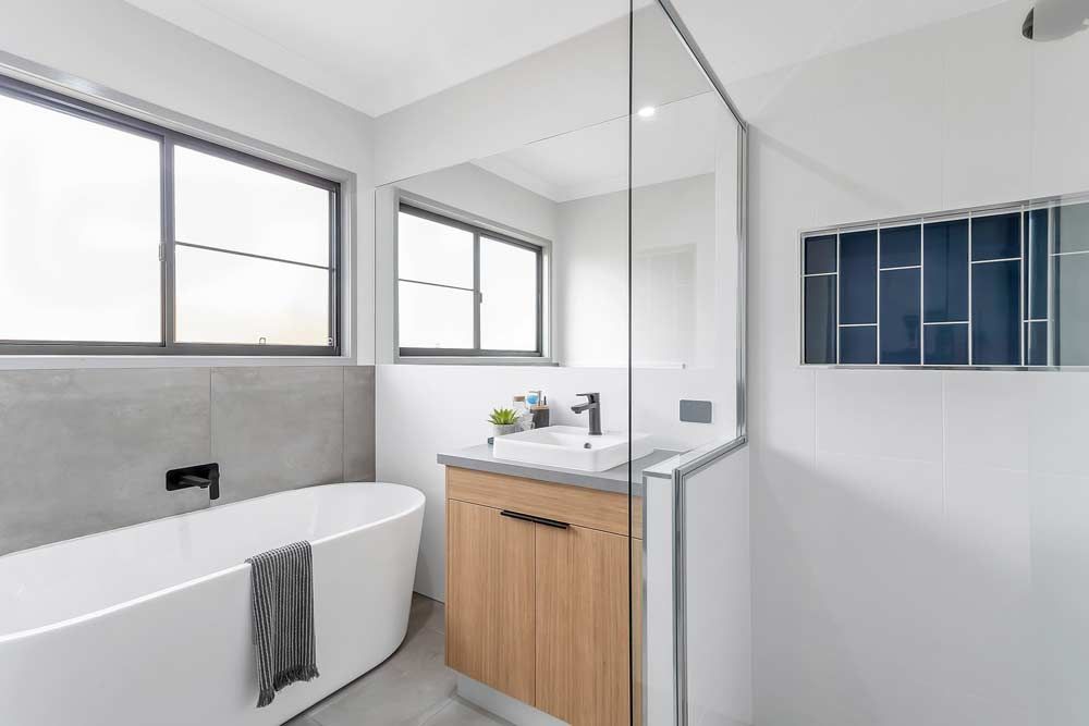 Bathroom With Shower And White Bath — Local Glaziers in Eton, QLD