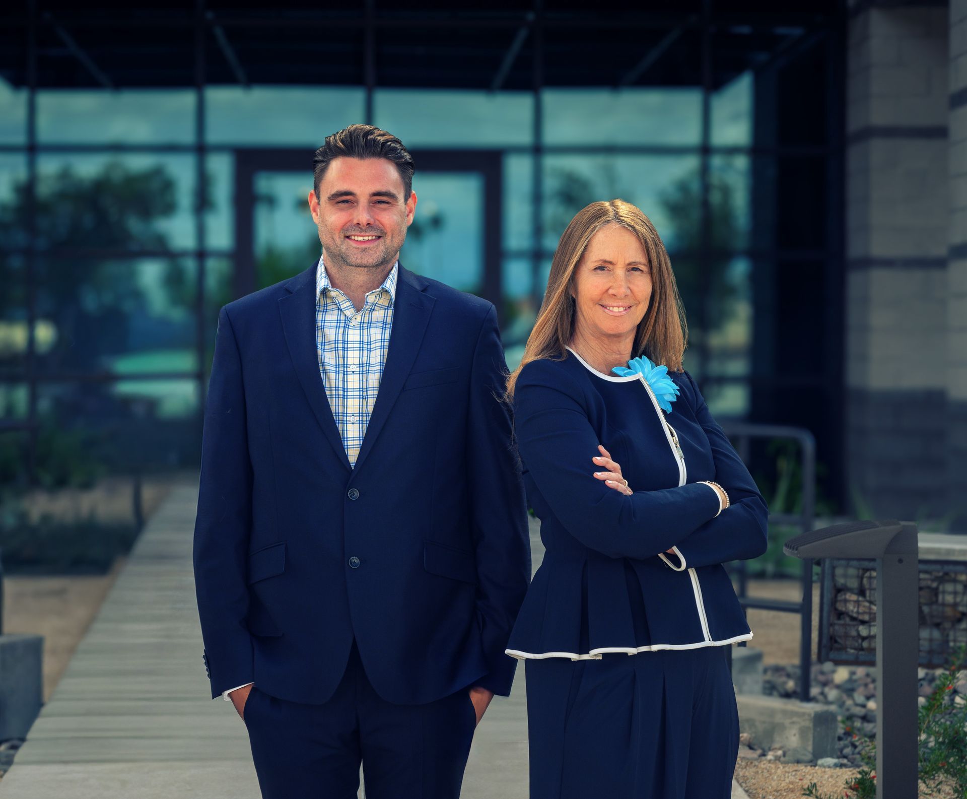 Serene reception area with beige couches, green plans and fountains