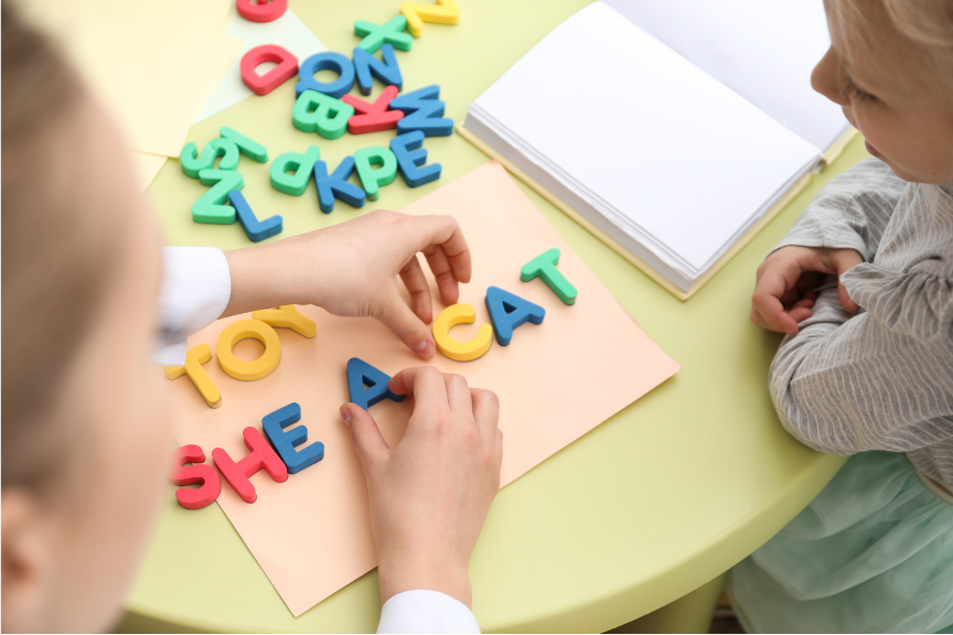 The letters a b c and d are made of wood