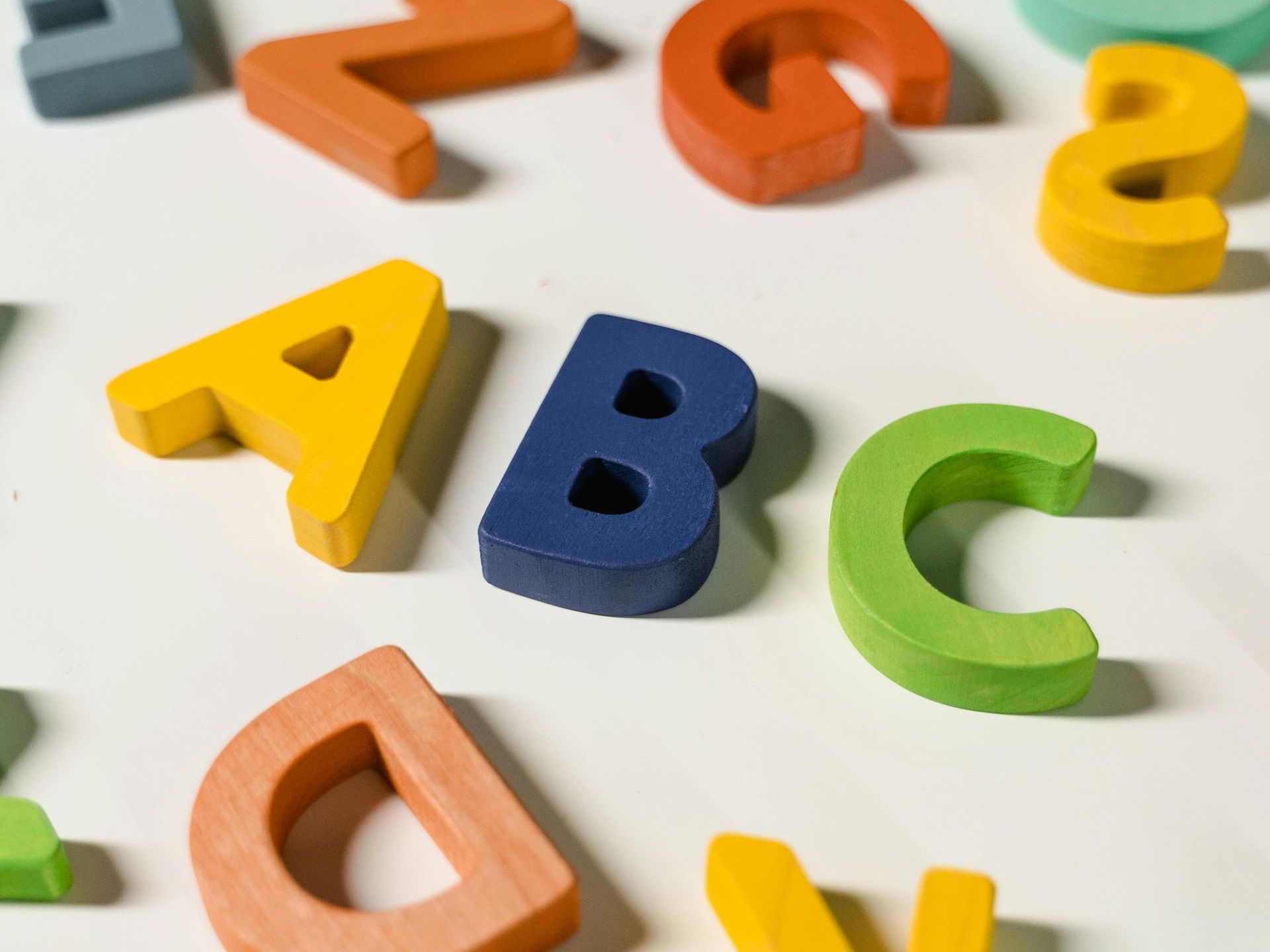The letters a b c and d are made of wood