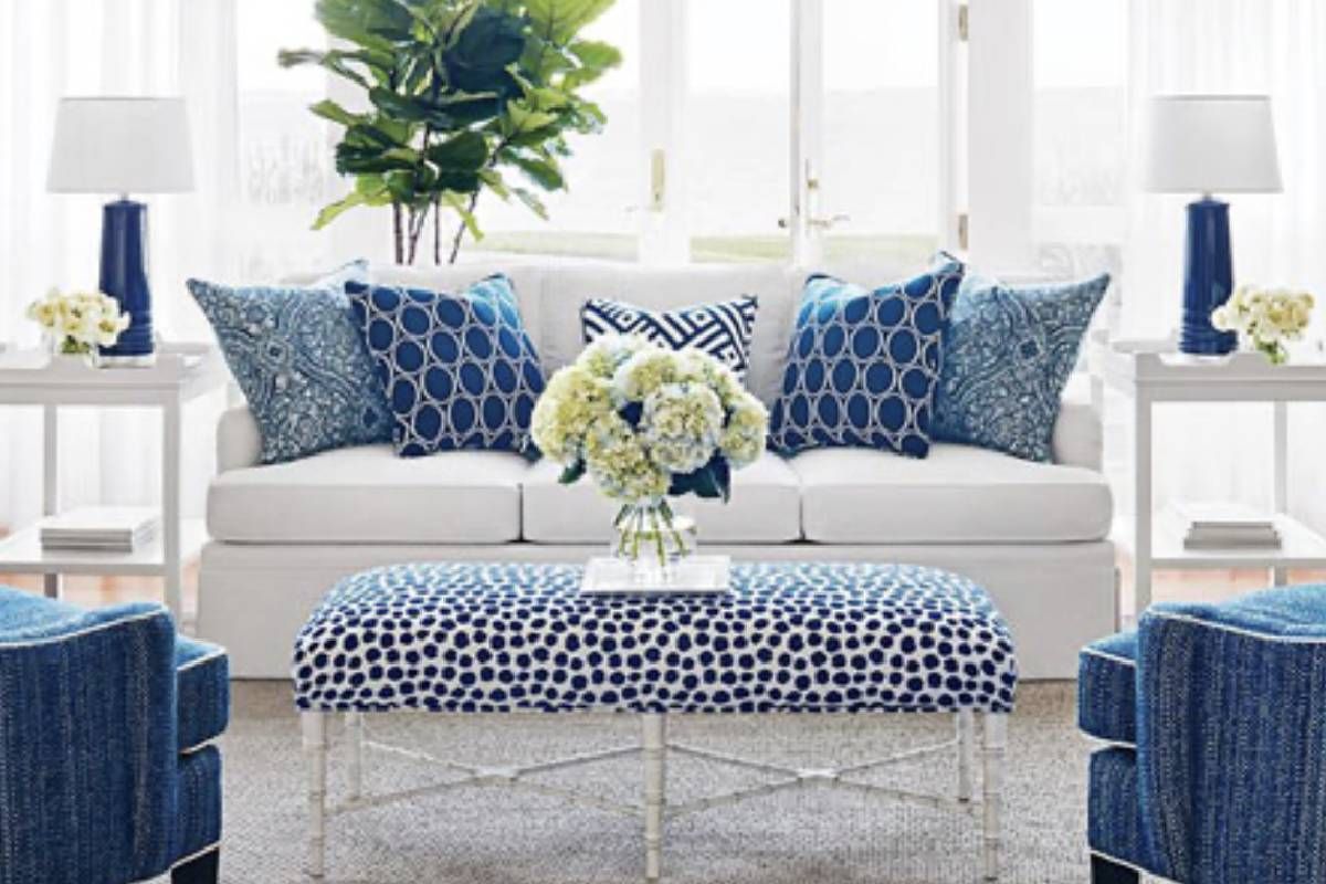 Living room home decor with a white couch and blue chairs