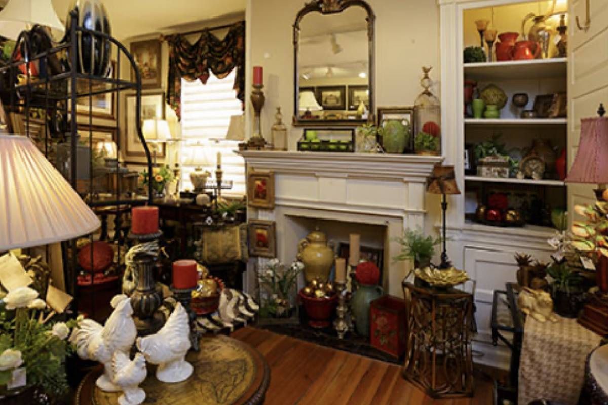 A living room decorated with furniture and a fireplace