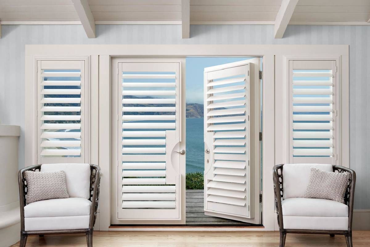 Two chairs are sitting in front of a door with white Hunter Douglas shutters. Interior Design  Decorating Custom Made Window Treatments Blinds
Shades Shutters Curtains Wallpaper Bedding Lamps Artwork Mirrors
Hunter Douglas Thibaut Trends Fabricut Carole Texas Paris Rods
Motorized powerview cordless top down / bottom up 
Wood Blinds Vignette Silhouettes Duettes Designer Screen Shades 
Fairfield Furniture Crestview Uttermost New Construction Renovations Builders
Interior Fancies Savannah House Grauers Phillips Interior Homes David’s Jackson’s
Martin’s Flooring Mods Blinds and Designs Graber Benjamin Moore Sherwin Williams
Garman Builders EG Stoltzfus Metzler Keystone Custom Homes Simeral Landmark
Bent Creek Country Club Lancaster County Country Club Highlands Tel Hai Garden Spot Village Willow Valley B&D Beacon Hill Scalamandre area rugs Anna French Sunbrella Pindler grass cloth Ralph Lauren Ron Redding Top Shelf Silk Linen Leather Velvet Range Rover Sport Mercedes Benz BMW Investment High End Luxury Ironstone Homes Main Line B&D Elite Turnberry European Builders Greth Grande Cedar Knoll Builders Rotelle Forest Ridge Builders Lexington Hoover Weaver
Lancaster Wyomissing Sinking Springs Lititz Akron Strasburg Manheim Hershey Ephrata Denver Adamstown Honeybrook Elverson Morgantown Exton Chester Springs West Chester Wernersville Mohnton Millersville Willow Street Kennet Square Thorndale Brandywine Paoli Malvern Newtown Square Media Radner Ardmore Devon Berwyn Hummelstown 
