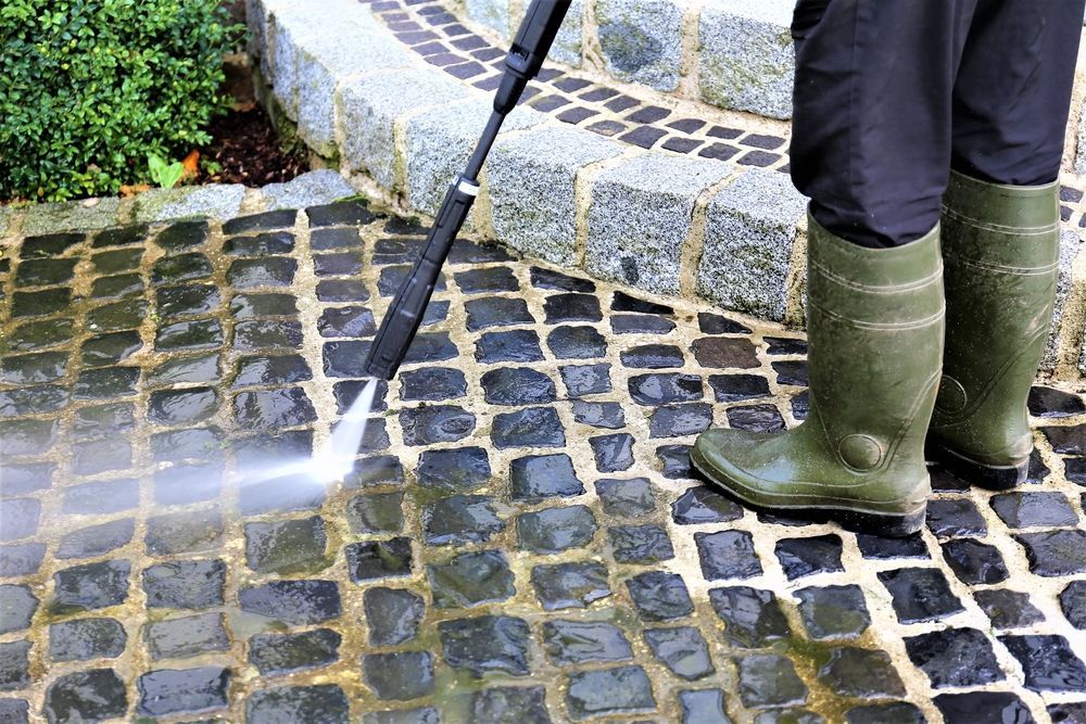 Person in Green Boots Pressure Washing — Crystal Clear In Glen Innes, NSW