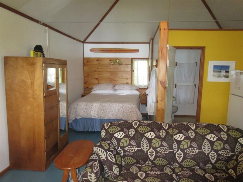 A bedroom with a couch and a bed in it