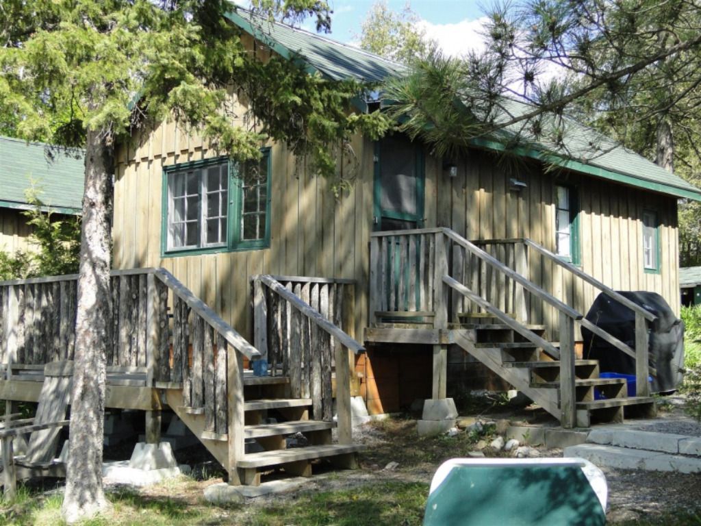 A small house with stairs leading up to it