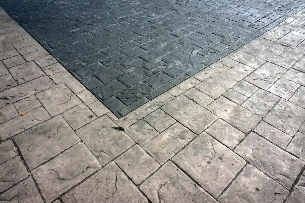 Cobblestone effect concrete patio with light beige  border