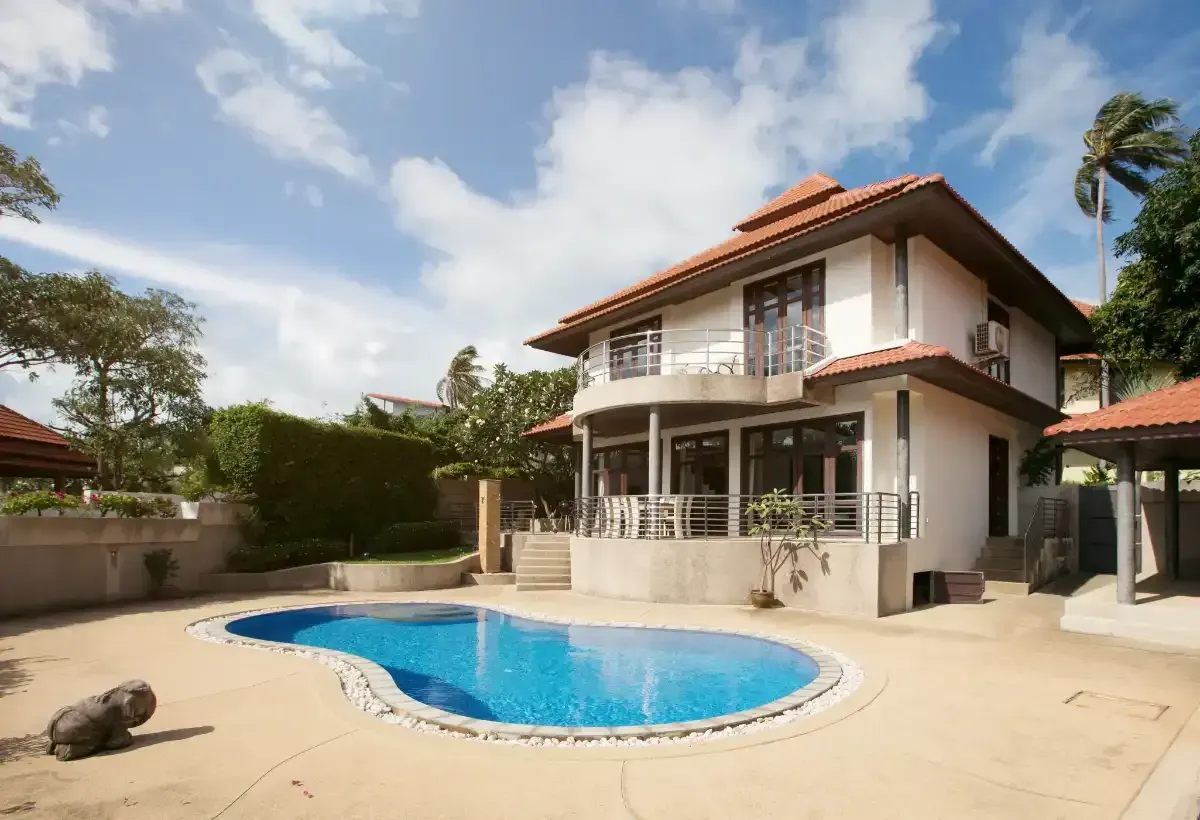 backyard pool in Florida with concrete pool deck