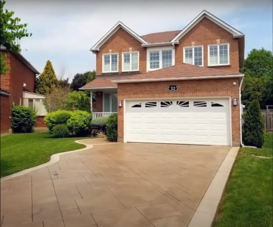 Light coloured cut concrete driveway