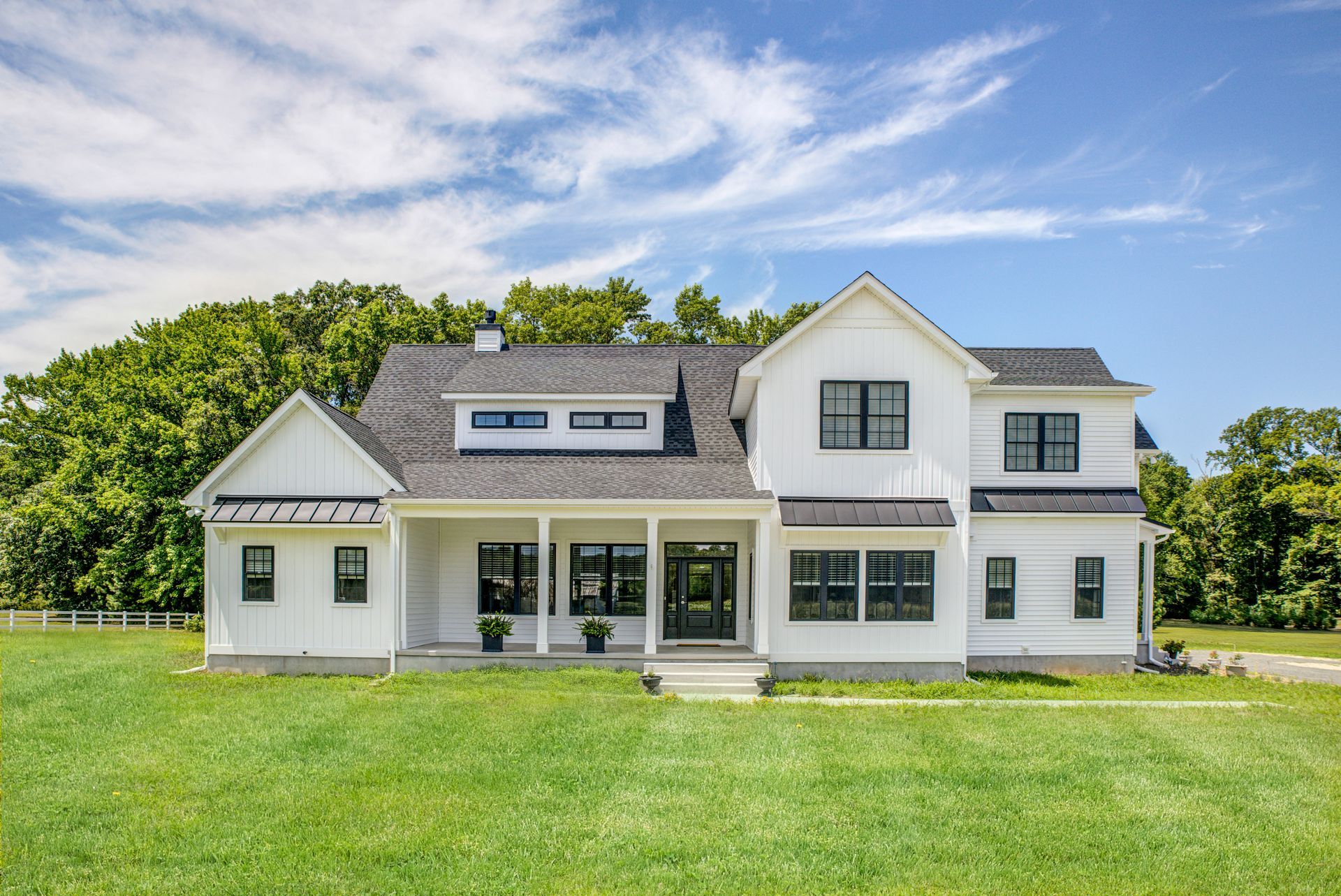Grey home exterior with large porch | Bay to Beach Builders | Greenwood, DE 19950