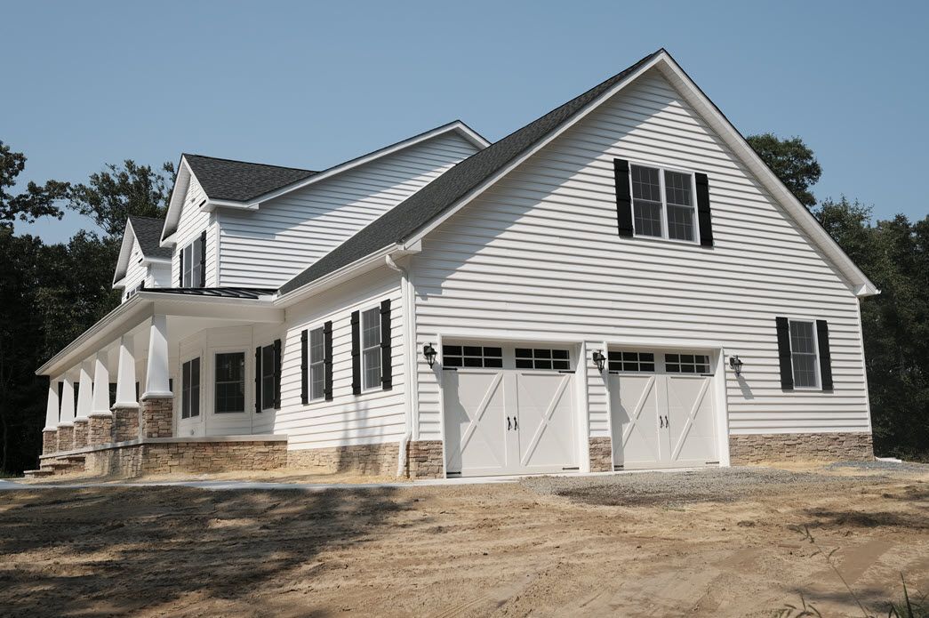 White home exterior with garage detail | Garages | Bay to Beach Builders | Greenwood, DE 19950